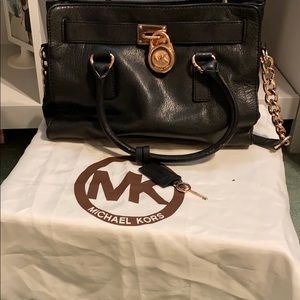 Micheal kors black and rose gold.